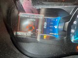 a car dashboard with a digital display on it ' s dashboard
