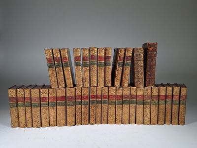 several books are stacked on top of each other on a table