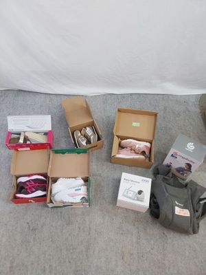 many boxes of items sitting on the floor next to each other