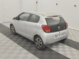 a picture of a small car parked in a garage