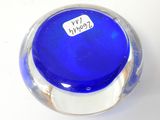 a blue glass vase with a sticker on it