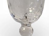 a glass bowl that is sitting on top of a table