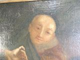 un tableau représentant une femme tenant un chien sur ses genoux