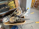 a wheelbarrow with a bunch of tools in it