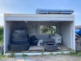 a storage container with tires and other items in it