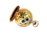 a gold pocket watch on a white surface with a white background