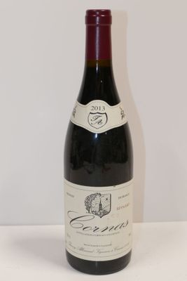 a bottle of wine that is sitting on a table