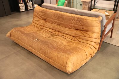 a couch that is sitting in the middle of a room