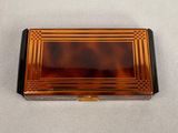 an image of a tortoise shell box on a white surface