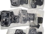 four pieces of luggage that are wrapped in plastic bags