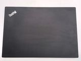an image of a black mouse pad on a white surface