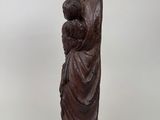 a statue of a woman holding a baby in her arms