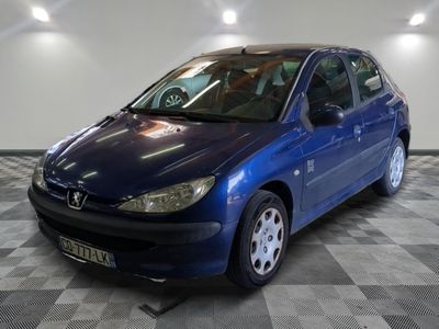 a picture of a blue car parked on a checkered floor