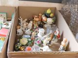 two boxes full of toys sitting on the floor