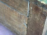 an old wooden box with a handle on it