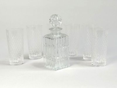 four glasses and a decanter on the table