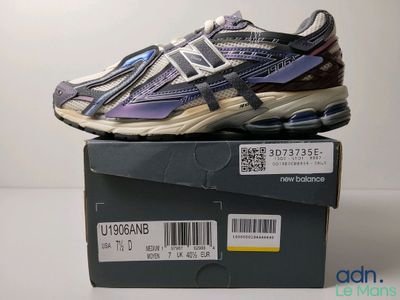 the new balance 991 running shoe is on top of a box