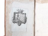 an old book with a drawing of a coat of arms on it