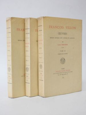 two books sitting on top of each other on a white surface