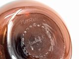 a close up of a glass bottle with a liquid inside of it