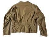the back of a tan jacket with buttons on it