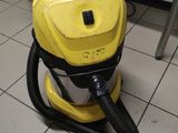 a yellow vacuum that is sitting on a tiled floor