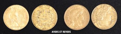 four different types of gold coins on a black surface