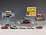 a display of various model cars on a glass shelf