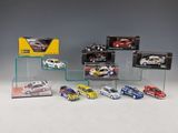 a lot of toy cars on display on a table