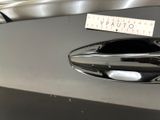 a close up of a car door handle with a sticker on it