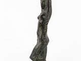 a bronze statue of a woman holding a child