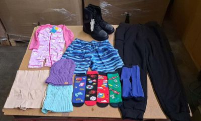 many pairs of socks, socks, socks, and socks on a table
