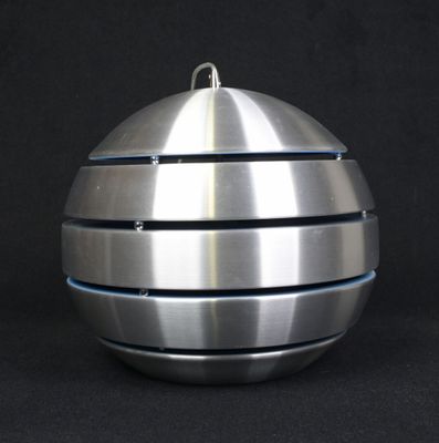 an image of a metal ball ornament on a black background