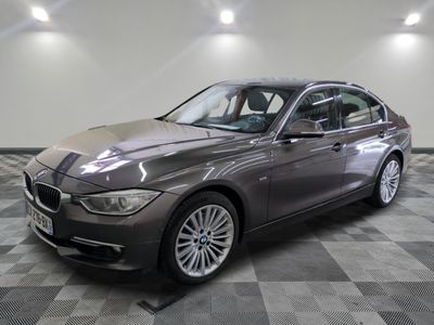 an image of a grey bmw car in a showroom