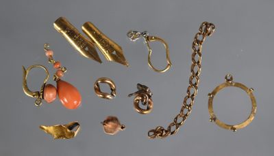 an image of a collection of gold jewelry on a gray surface