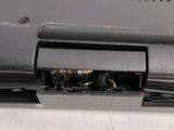 a close up of a laptop that has a small hole in it