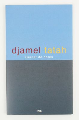 a blue notebook with a black cover and a red and yellow logo