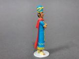toy figurine of a man dressed in blue and red standing on a white base