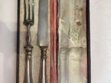 a knife and fork in a case on a table