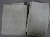 two white napkins with chinese writing on them sitting next to each other