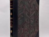a black book with a red and black design on it