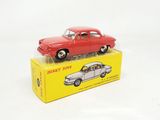 a red toy car sitting on top of a yellow box