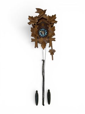 an image of a cuckoo clock hanging on a wall