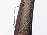 an old wooden object with a decorative design on it