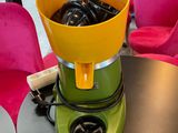 a blender sitting on a table with a bowl on top of it