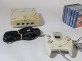 a video game system and a game controller on a table