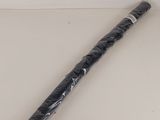 a baseball bat that is wrapped in plastic and sitting on a table