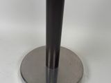 the base of a table with a metal base and a black top