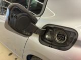an electric car being charged at a charging station