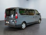 a grey van that is parked in a room